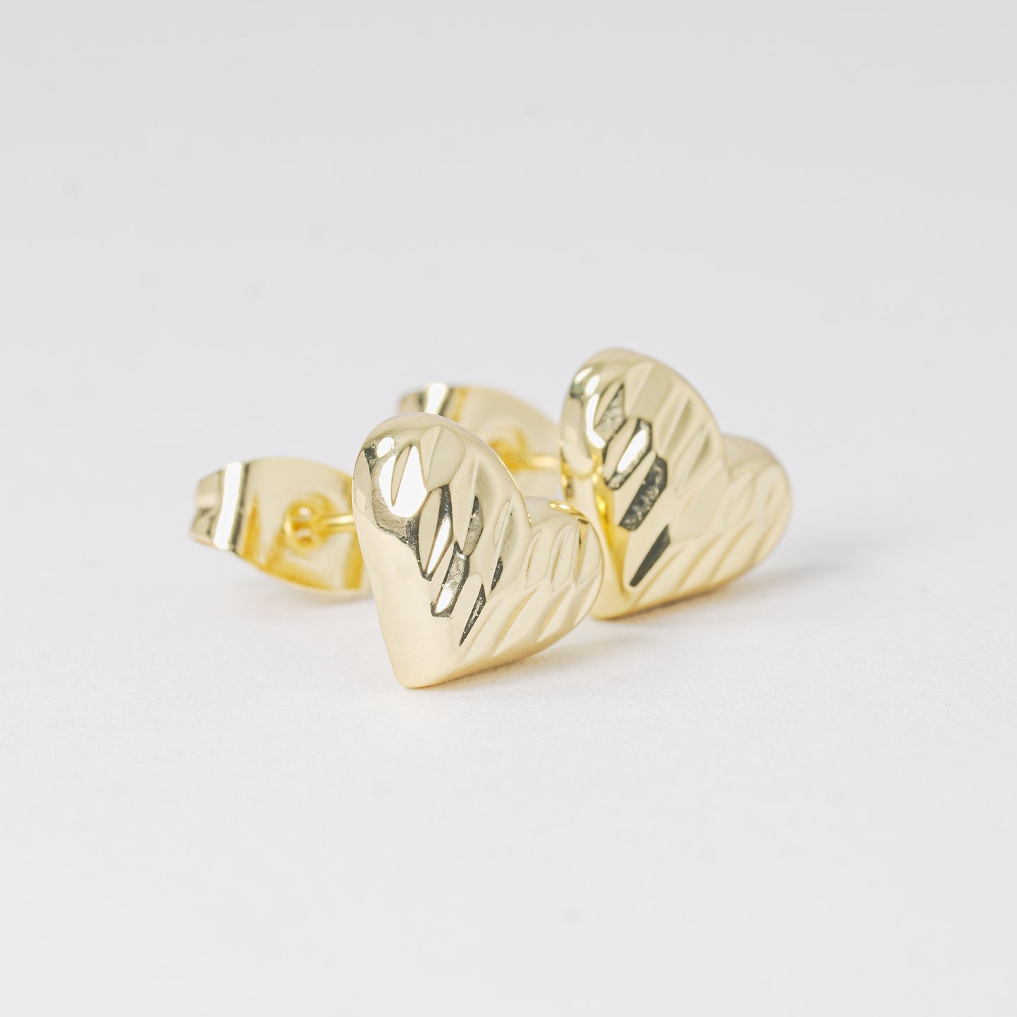 Topo corazón dorado