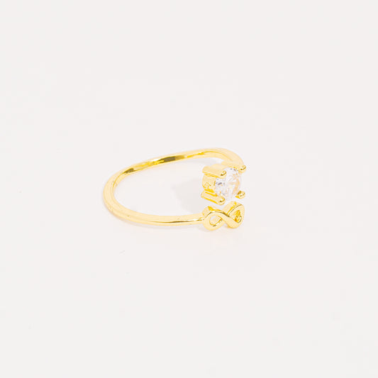 Anillo dorado infinito brillante