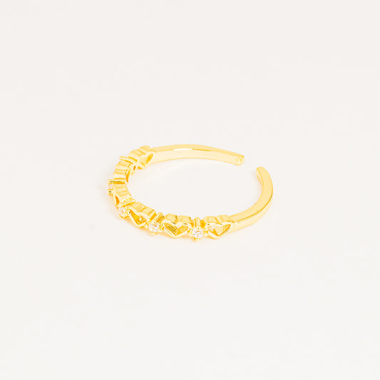 Anillo dorado corazones brillando