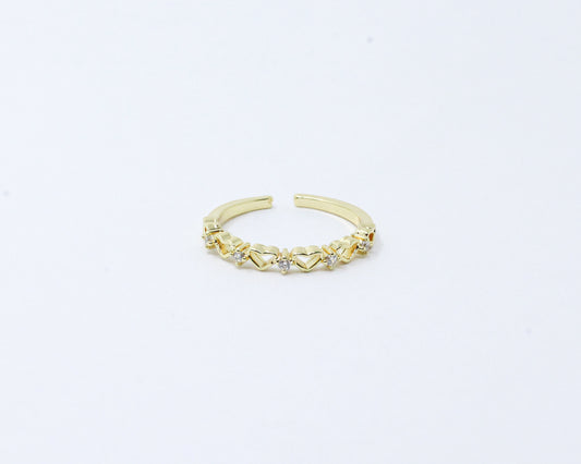 Anillo dorado corazones brillando