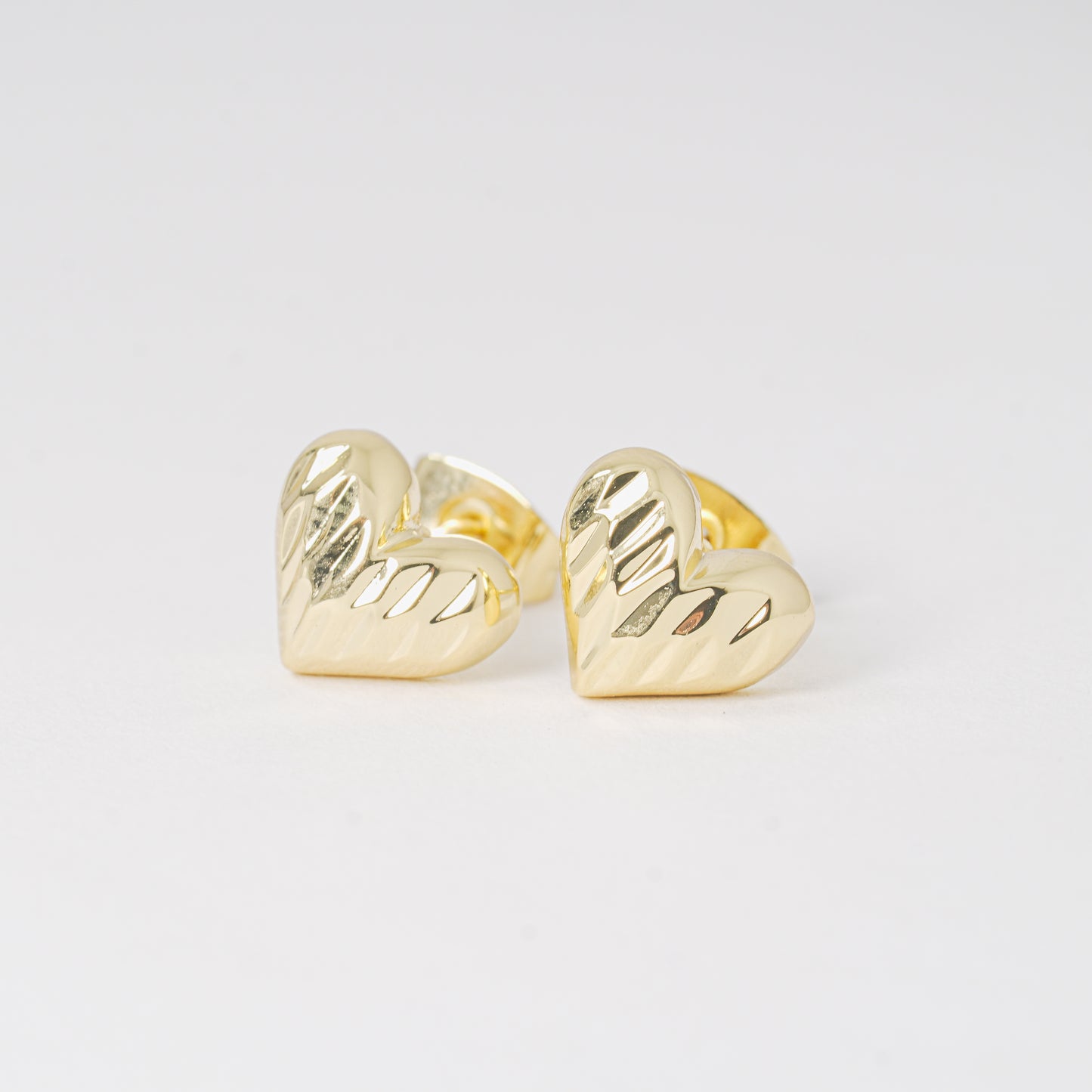 Topo corazón dorado