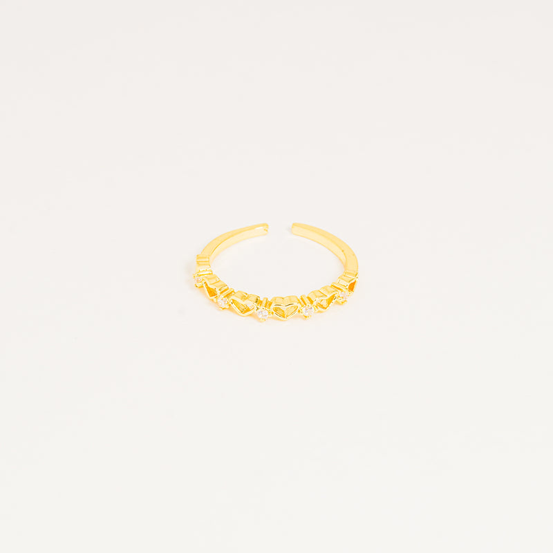 Anillo dorado corazones brillando